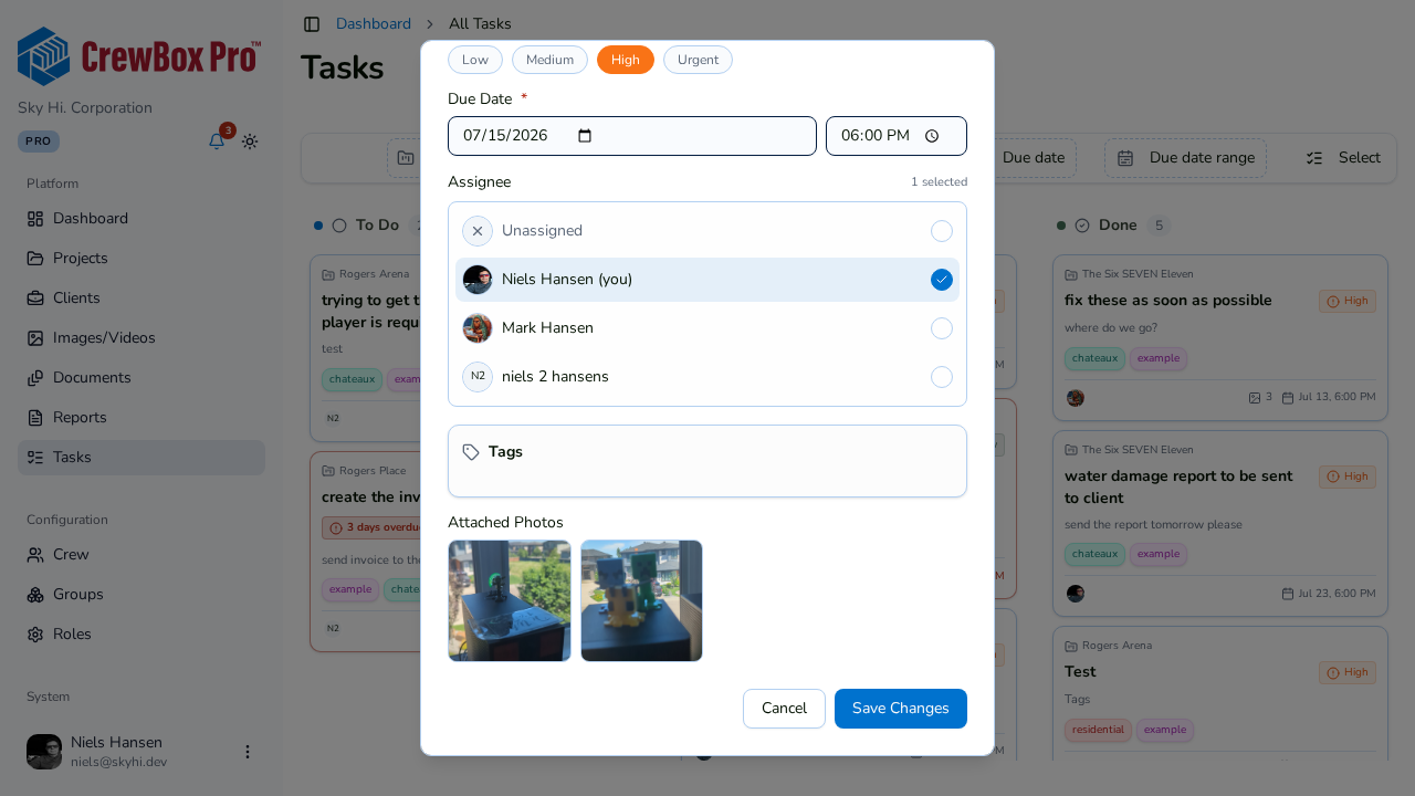 Attach photos and documents to a task from its dialog.