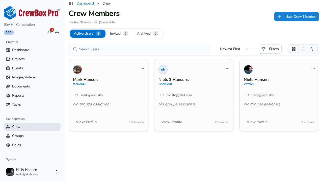The Crew Members page: seats, active/invited/archived tabs, and member cards.