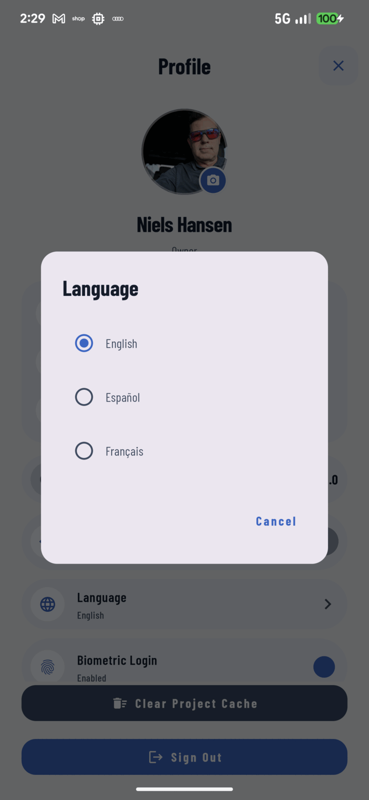 CrewBox language settings in English, Spanish, and French on a phone